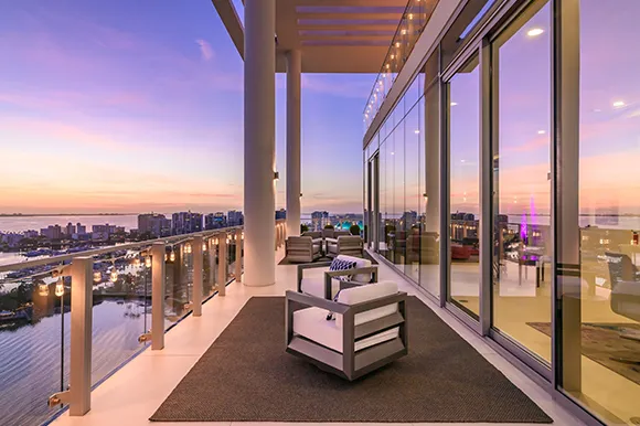 Stunning view of a high-rise condo with a balcony overlooking the city in Kendall, FL